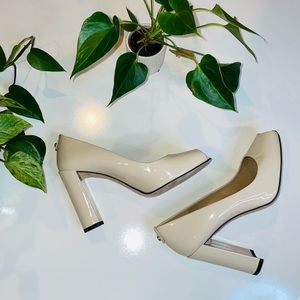 Stuart Weitzman Lille Nude Patent Leather Peep Toe Pumps